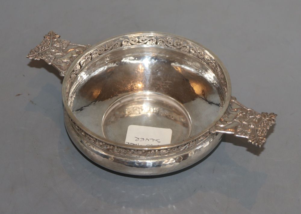 A George V Arts & Crafts pierced and planished silver two handles bowl (lacking liner?), by Albert Edward Jones